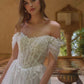 Vestido de Novia Escote ilusión con hombros descubiertos, apliques florales y mangas drapeadas transparentes.